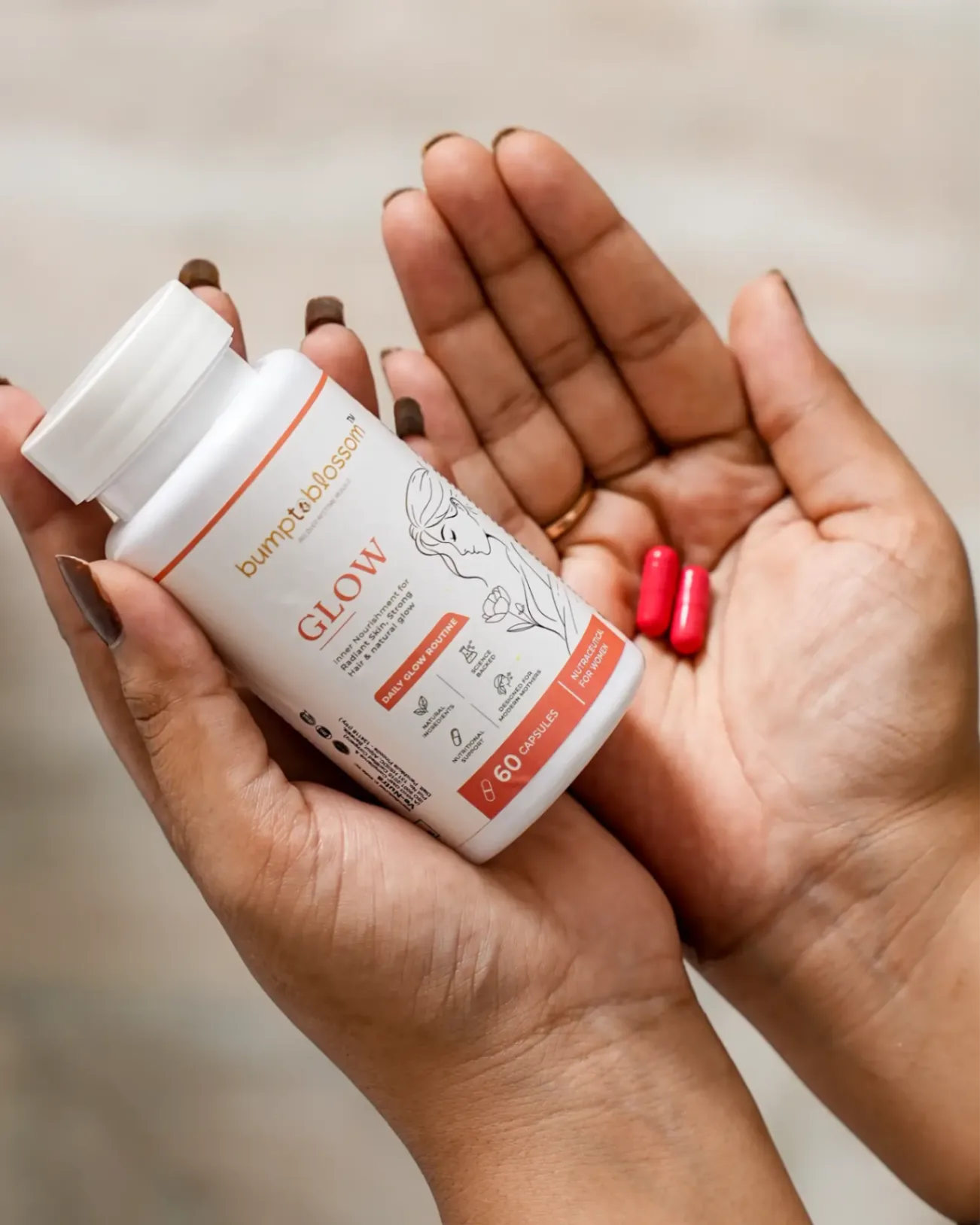 Bump to Blossom Glow product held in hands